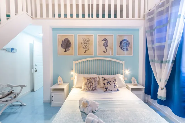 غرفة بريميوم رباعية بسرير كوين وسريرين منفصلين، Quattrocuori Room & Relax 1/3
