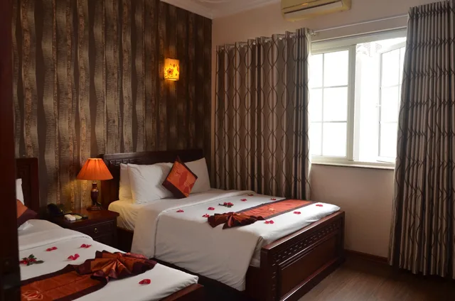 غرفة ديلوكس عائلية بسرير كوين وسرير فردي، Phoenix Legend Hotel 2/10