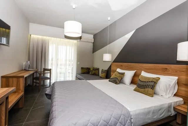 غرفة قياسية بسريرين منفصلين مع أريكة، Exotica Hotel and Spa by Zante Plaza 1/4