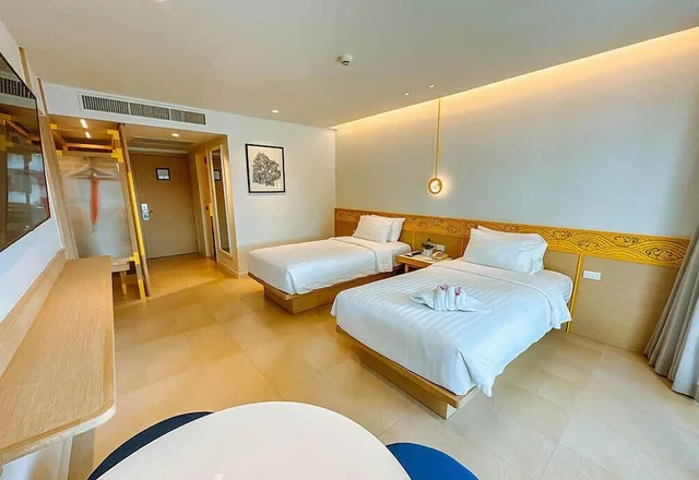 غرفة ديلوكس بسريرين منفصلين بإطلالة على الحديقة، Novotel Rayong Rim Pae Resort 3/6