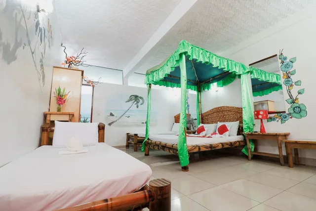 غرفة اقتصادية رباعية بسرير كوين وسريرين منفصلين، Kokosnuss Garden Resort 2/4