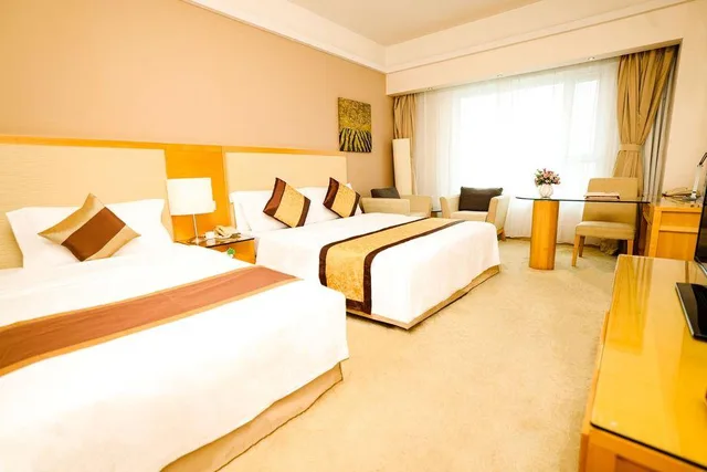 غرفة ديلوكس عائلية بسرير كوين وسرير فردي، Haiyue Jianguo Hotel 1/2