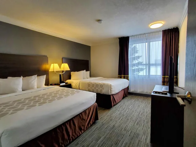 Pacific, Suite, 2 Queen Beds, Sofa, Kitchen, Super 8 by Wyndham Macleod Trail Calgary 1/3