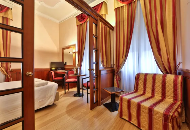 غرفة سوبيريور بسرير كوين وسرير فردي بمنطقة جلوس، Best Western Hotel Moderno Verdi 5/6