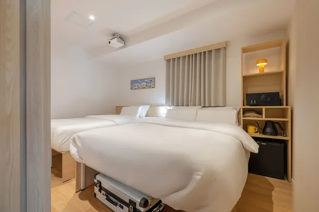 غرفة قياسية ثلاثية بسرير مزدوج وسرير فردي، Myeongdong Guesthouse Como 3/9