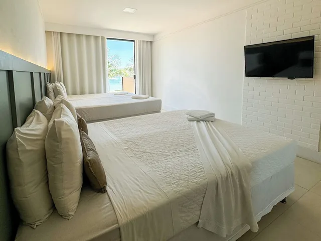 غرفة ديلوكس رباعية بسرير مزدوج وسريرين منفصلين بإطلالة على القناة، Hotel Premium Recanto Da Passagem 2/3