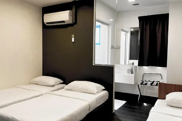 Superior, Triple, 2 Double Beds, No Window, A Hotel Desker 1/1