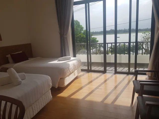 غرفة بسريرين منفصلين بشرفة، Gia Huy Riverside Hotel Hoi An 7/10
