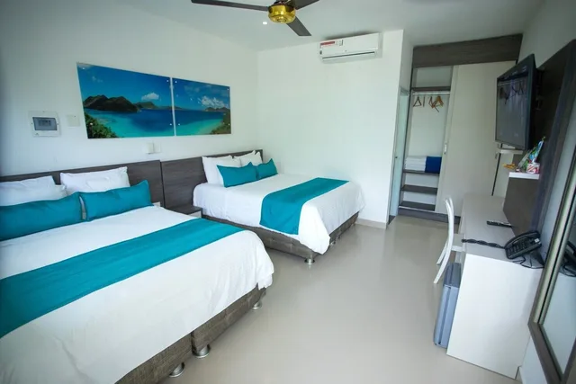 غرفة قياسية رباعية بسريرين مزدوجين، Hotel Poblado Covenas 3/5