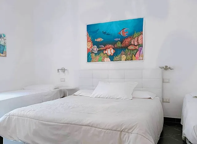 غرفة سوبيريور رباعية بسرير كوين وسريرين منفصلين بمطبخ صغير، Sardegna Sole E Mare 1/6