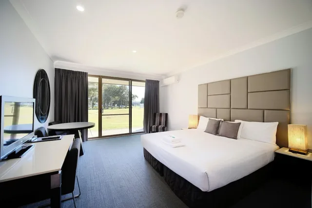 غرفة تنفيذية بسرير كينج، ISLAND PALMS MOTOR INN 1/4